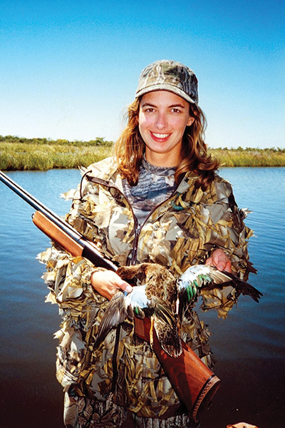 Lydia Lohrer shows off a blue-winged teal she killed. Teal season in Alabama is Sept. 12-27, with a limit of six per day. Photo by John N. Felsher