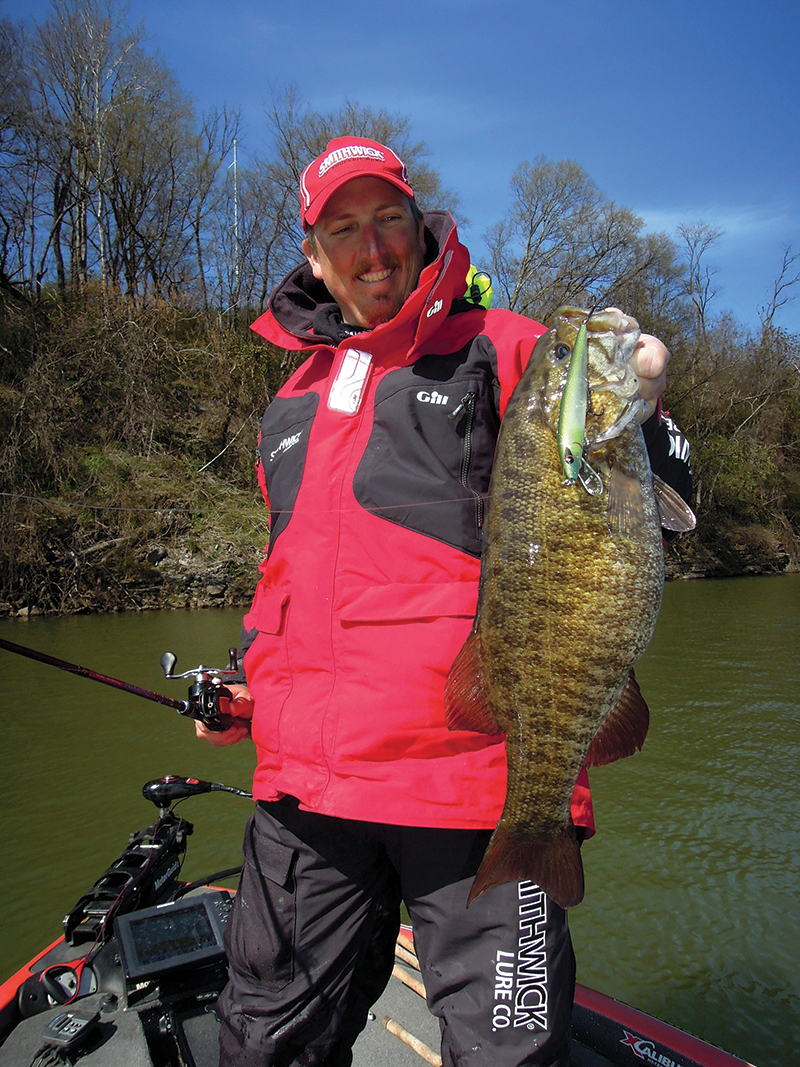 Jimmy Mason, a bass pro from Rogersville, Ala., shows off a smallmouth bass he caught on a jerkbait while fishing at Pickwick Lake near Florence, Ala. Photo by John N. Felsher