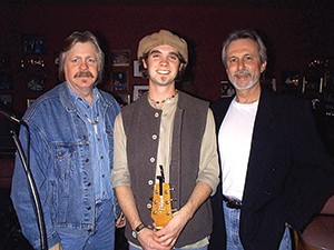 A young Bo Bice, center, got encouragement at a Songwriter’s Showcase from Mickey Buckins, left, and showcase organizer and musician Jerry McGee. Bice later went on to become runner-up on “American Idol,” finishing behind winner Carrie Underwood, in 2005.