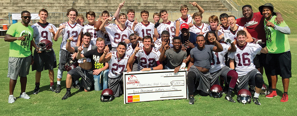 Rashad Johnson continues to give back to young people in the area around his hometown of Sulligent in northwest Alabama. Here, he presents a $5,000 check to Hamilton High School.