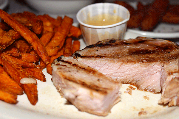 Sweet potato fries and smoked pork chop compliment each other. 