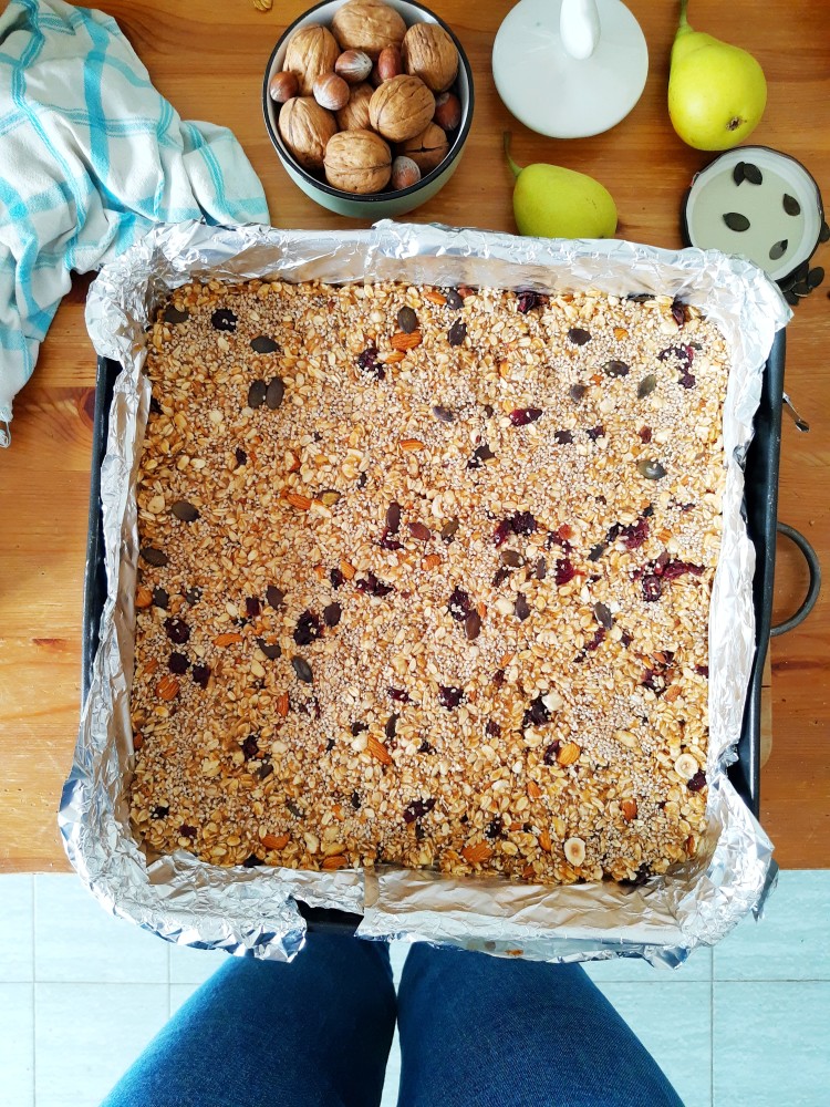 freshly-baked-oatmeal-granola-mix-with-seeds-and-dry-fruit-for-granola-bars-in-baking-tin-ready-to-be_t20_A9mkNr