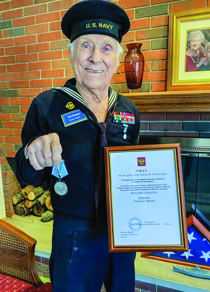 Former USS Alabama crewman Wilbert Rozum displays his Medal of Ushakov. Rozum, age 99, is wearing the Navy uniform he wore during World War II. Photo courtesy of USS Alabama Battleship Memorial Park