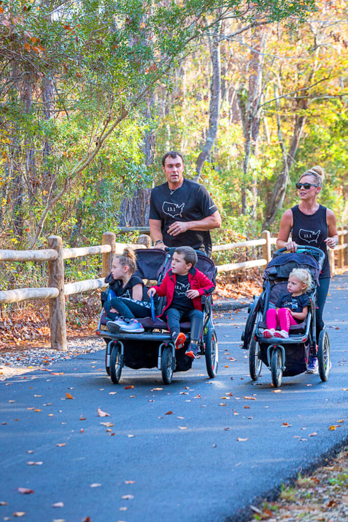 Families pushing children in strollers