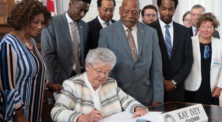 Gray, second from left, stands behind Gov. Kay Ivey at the signing for two bills put forward by the Alabama Innovation Commission.
Photo by Hal Yeager/Governor’s Office