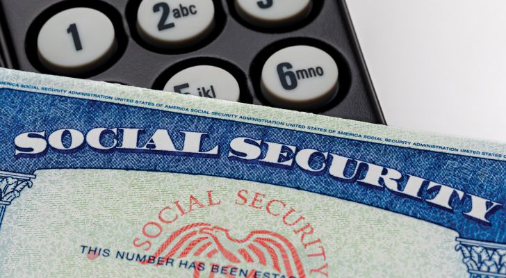 Social security card and telephone. Fraud, scam and identity the